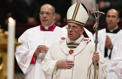 Pope Francis leads a procession after celebrating Christmas Eve Mass in St. Peter's Basilica at the Vatican on Dec. 24, 2013. Photo by Paul Haring, courtesy of Catholic News Service